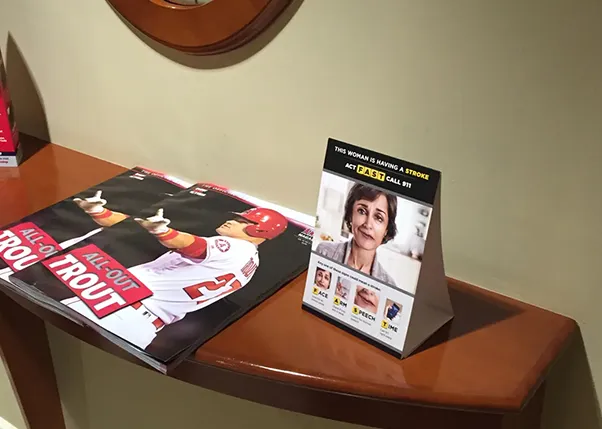 Strike out stroke marketing materials on the table at a baseball stadium