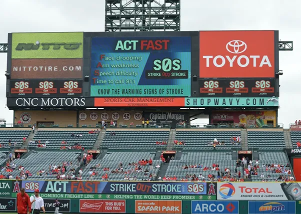 Strike out stroke act fast ad on the baseball field big screen