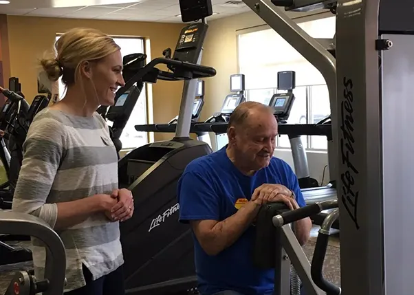 Personal Trainer and Stroke Survivor Working Out On a Machine