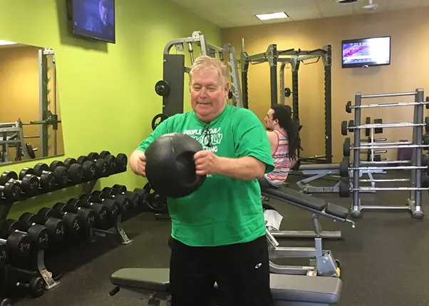 Stroke Survivor Doing Weighted Ball Exercises