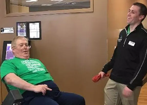 Stroke Survivor and Personal Trainer Laughing In Anytime Fitness